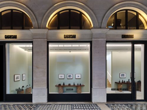 Exterior photo of the Gagosian Paris art gallery, with the exhibition 'Moore and Malaparte: Rhythm and Form' visible through the three large windows.