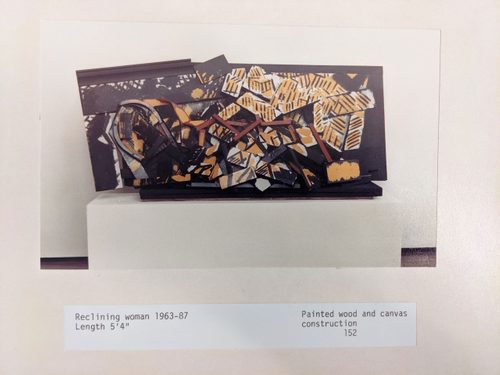 An abstract sculpture by Anthony Hatwell, constructed from wood and canvas and painted in black, yellow and red.