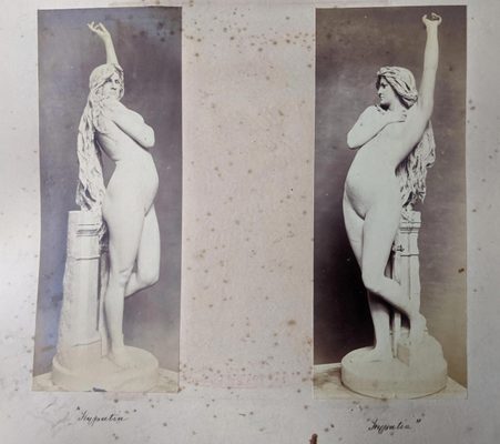 Two black and white photos of a standing nude woman with long, flowing hair. Her left arm is raised skyward, while her right covers her breasts.