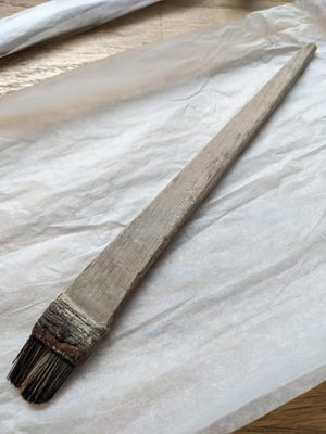 A large brush with a flat head.