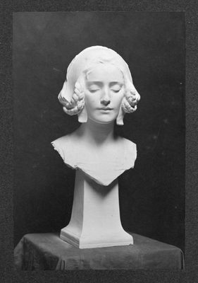 Black and white photo of a plaster portrait bust of a young woman. Her hair is in braids and she is looking down demurely.