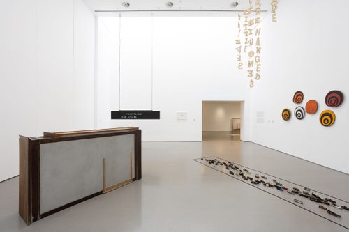 Installation view of 'The Weight of Words' exhibition, showing works in Gallery 2 by Doris Salcedo, Shilpa Gupta, Issam Kourbaj, Tim Etchells and Emma Hart.