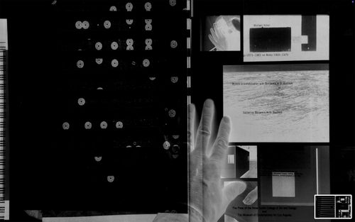 Black and white collaged artwork, with a ghostly hand sandwiched between two pieces of printed material.