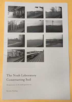 Cover of a black and white exhibition pamphlet, with eleven photos or a train station, a train, and views from a train window, laid out in a 3x4 grid. Text reads 