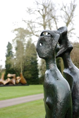 A close up photo focused on the heads of a bronze sculpture which depicts a King and a Queen
