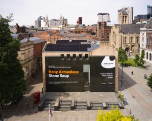 Ariel view of the Henry Moore Institute, showing the black granite facade to the front of the building and solar panels on the roof.