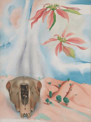 Painting by Georgia O'Keefe, showing an animal skull and two flowering plants over the top of a pink, desert-like landscape with a few small trees in it.