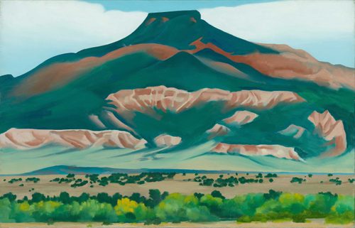 Painting by Georgia O'Keefe of a mountainous landscape in rich, earthy tones of green, teal, pink and brown.