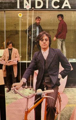 Cover of the book Riflemaker Becomes Indica, with a collaged photo of men standing around mimicking model poses.