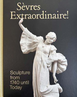 Cover of the book Sèvres Extraordinaire!, featuring a white plaster or marble sculpture of a woman in a dress on a navy blue cover.