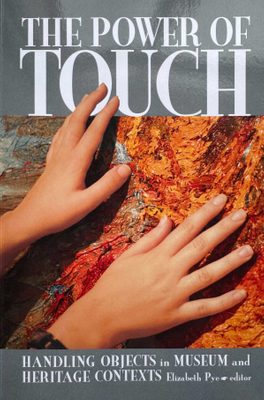 Cover of the book The Power of Touch: Handling Objects in Museum and Heritage Contexts, edited by Elizabeth Pye. The cover features a photo of hands touching the surface of a painting.