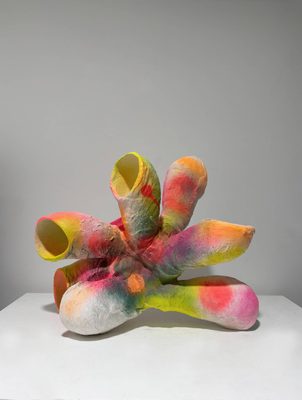 A multicoloured sculpture formed of tubular shapes resembling organic forms.